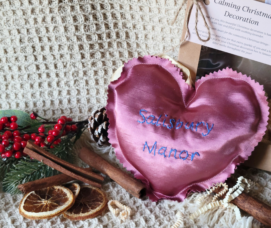 Christmas-themed decor including a pink satin heart with