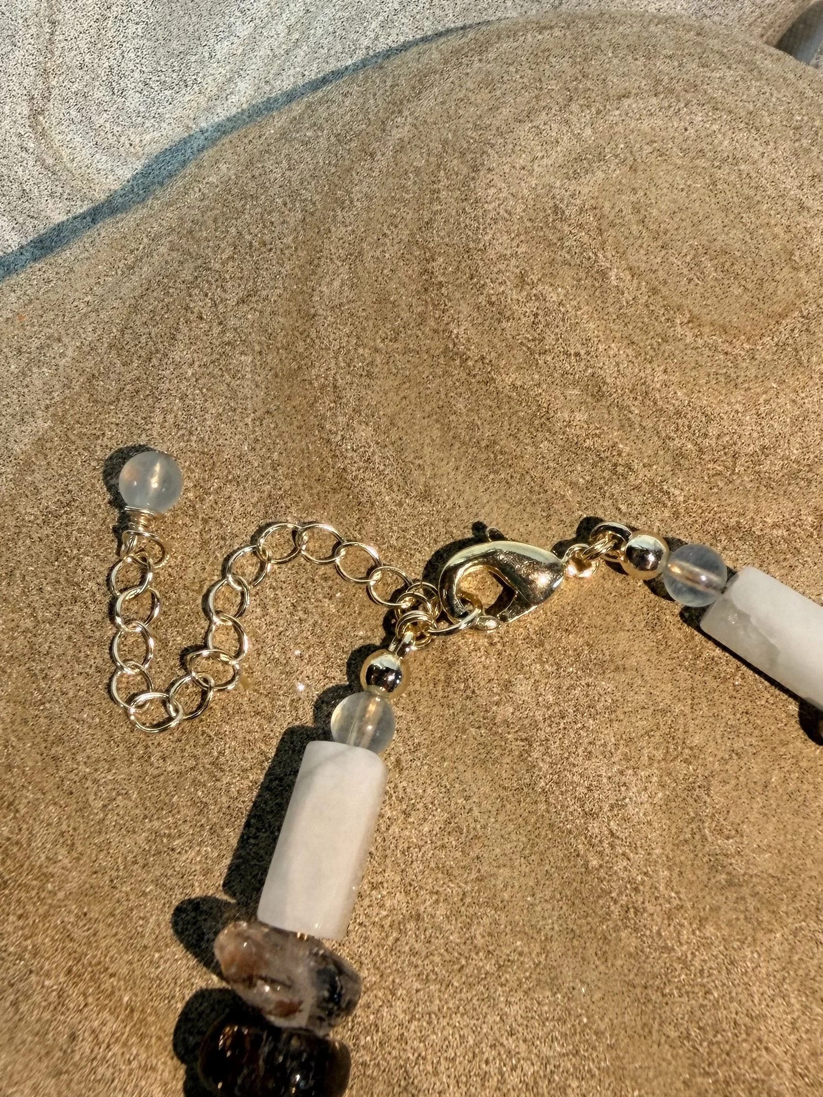 Close-up of the bracelet clasp and adjustable extender chain.