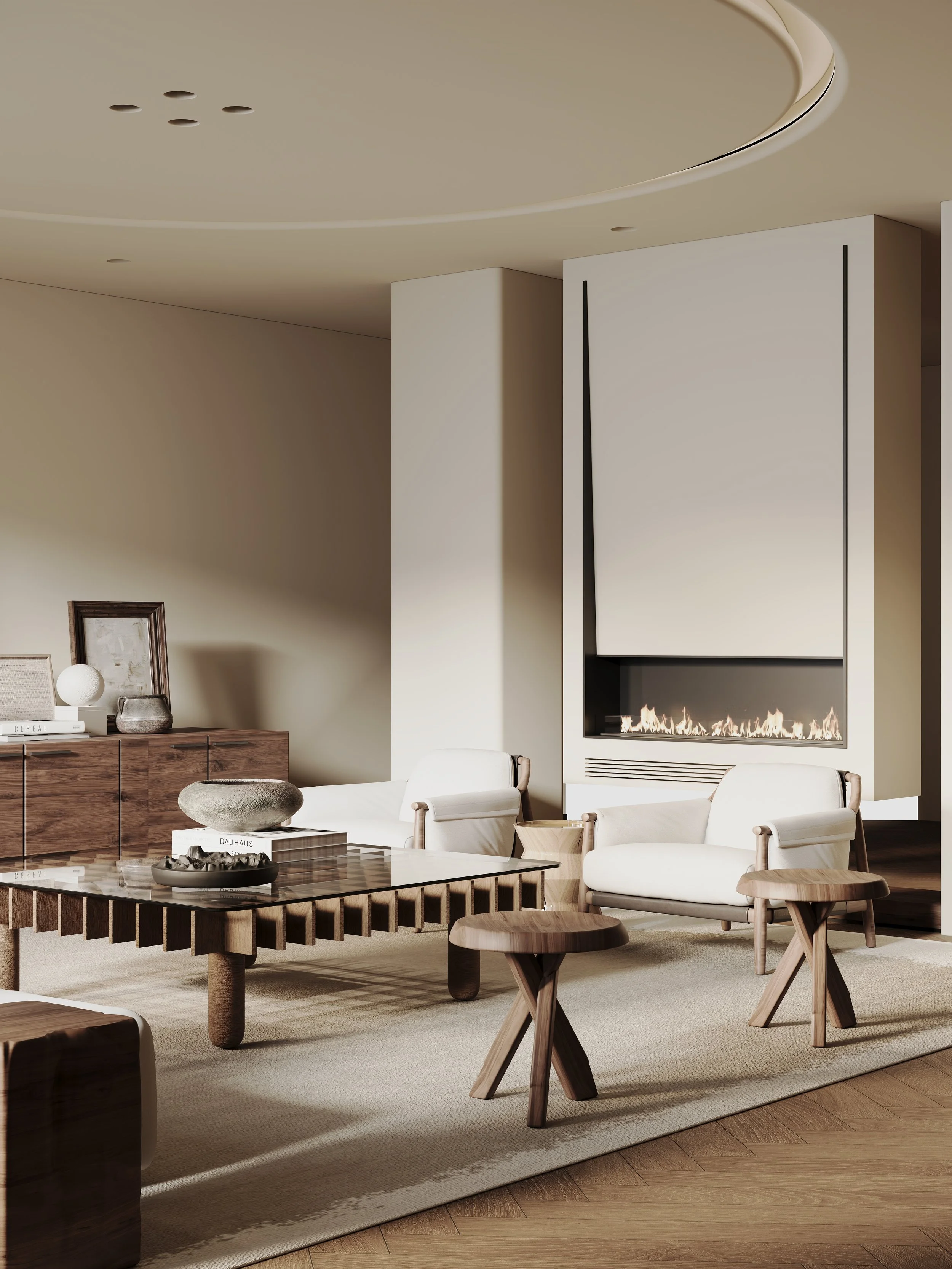 Modern living room with a fireplace, white armchairs, wooden side tables, a glass coffee table, and decorative objects on a light-colored rug.