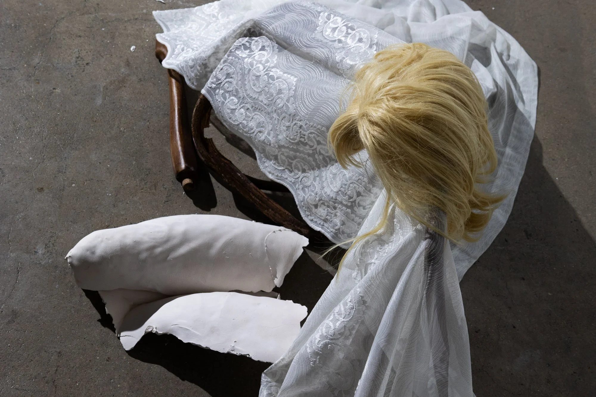 'Good Wife' (2026) | Wig, broken chair, white lace, lighting | 262 x 62 x 65cm