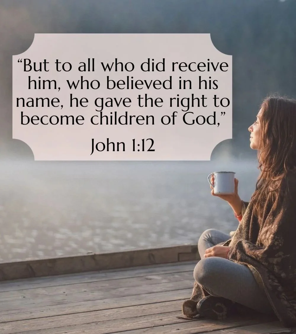 A woman sitting cross-legged on a wooden dock holding a mug, looking at a foggy lake or river. A text overlay features a biblical quote from John 1:12.