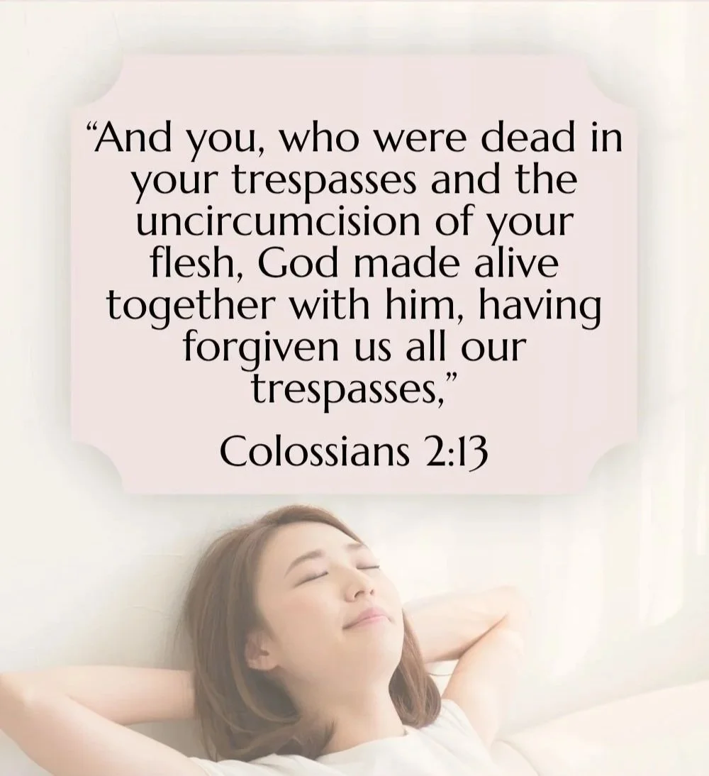 A woman relaxing with her eyes closed, lying on a bed. Overlaid is a quote from Colossians 2:13 about forgiveness and God's creation.