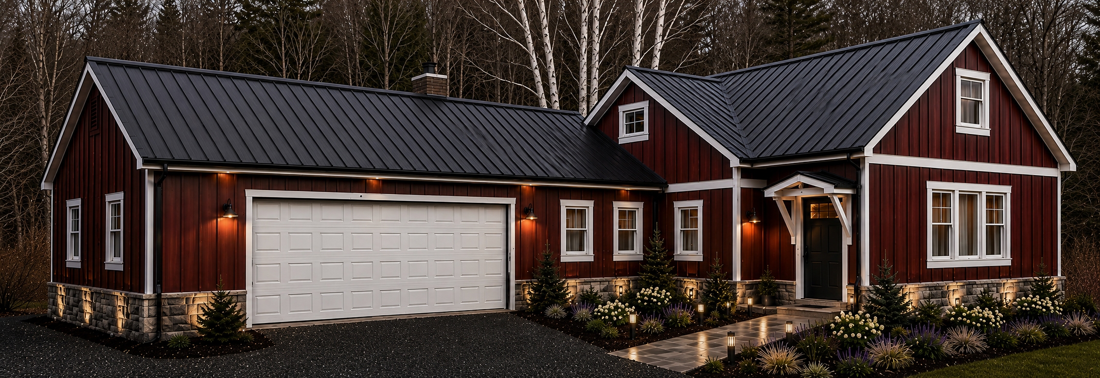 A charming two-story house with red wooden exterior, white trim, black metal roof, front porch, landscaped garden, and driveway, illuminated at dusk.