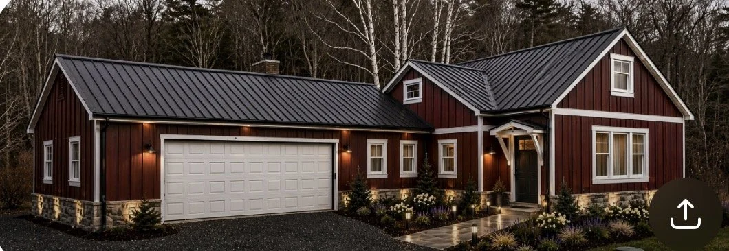 A red farmhouse-style house with white trim and a metal roof, featuring a two-car garage and a front porch, surrounded by a landscaped yard with small bushes and flowers.