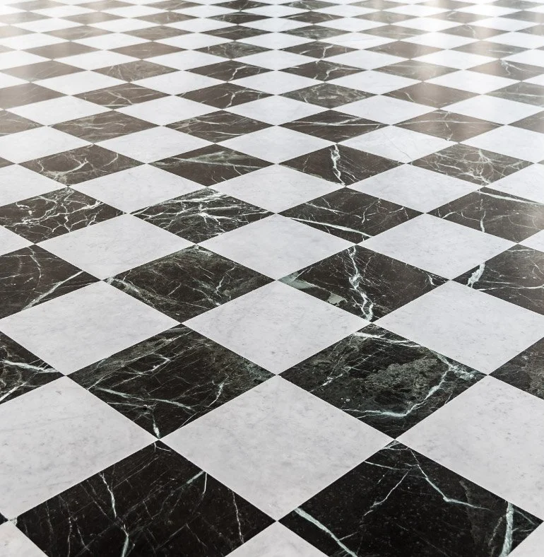 STUDIO21 bespoke checkered marble flooring design featuring high-end Nero Marquina and Carrara marble tiling for luxury palatial residences