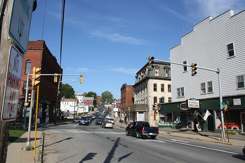 image of main st in spencer shot from the bottom of the hill showing both sides of the road heading up route 9