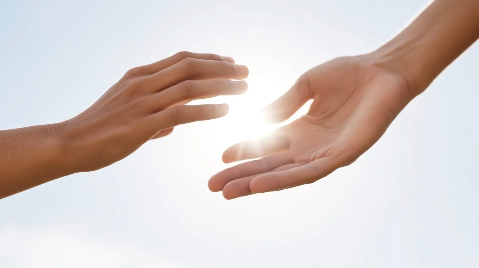 Hands reaching for each other