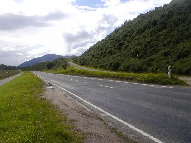 Cycle path beside the road and railway near Newtonmore — part of National Cycle Network Route 7 (Lochs and Glens) running through the village.