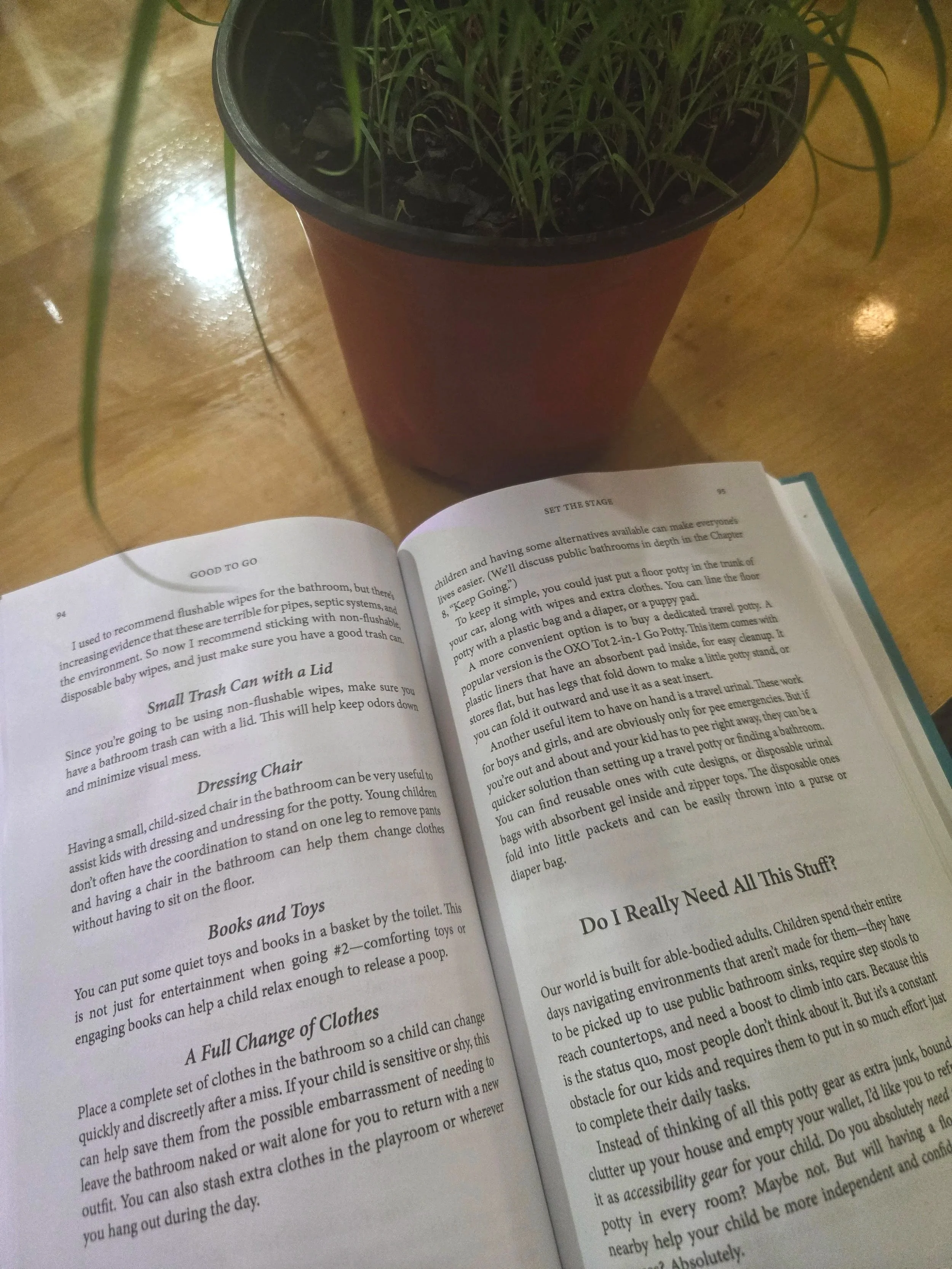 a book is spread open to a section about the supplies needed. It sits on the kitchen island next to a small lemongrass plant.
