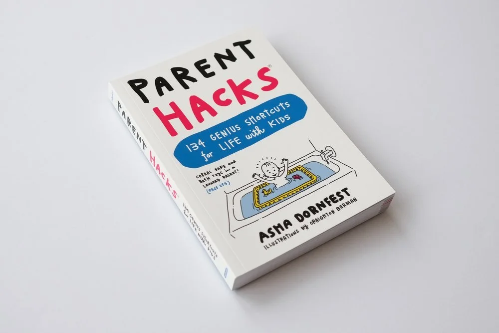 Book titled 'Parent Hacks: 134 Genius Shortcuts for Life with Kids' by Asha Dornfest, featuring a cartoon illustration of a baby bathing in a sink with toys and a towel.