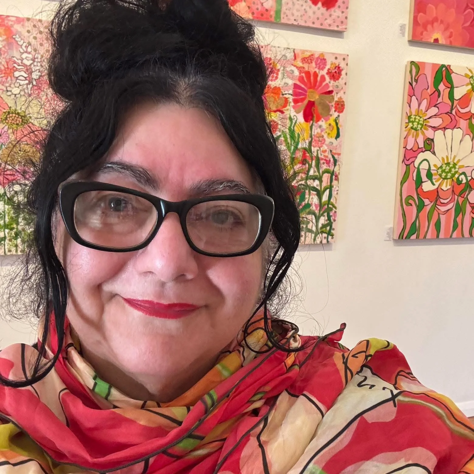 Maria Pezzano standing in front of artwork at studio