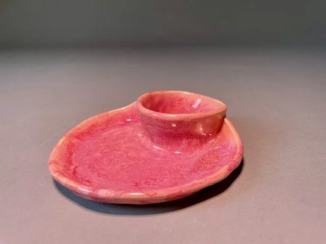 A small pink ceramic pottery snack/dip bowl/tray. 
