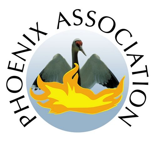 The Phoenix Society logo features a black and white bird with a red head and a long beak, sitting in a yellow flame with mountains in the background.