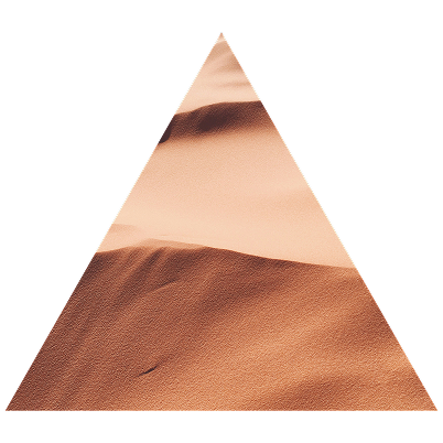 Sand dunes in a desert with a triangular crop shape