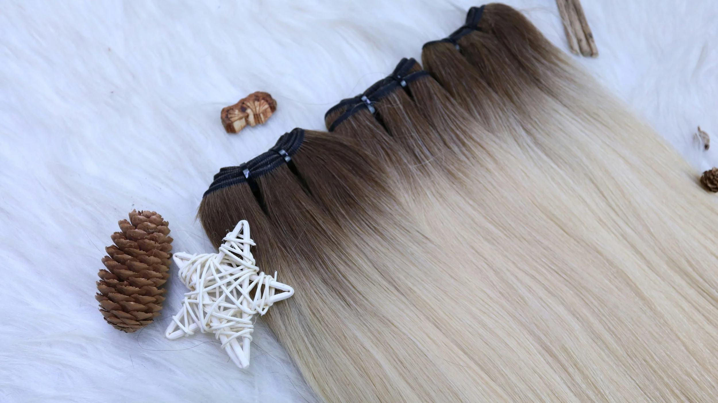 Natural-looking blonde hair extensions showing added length, volume and fullness.