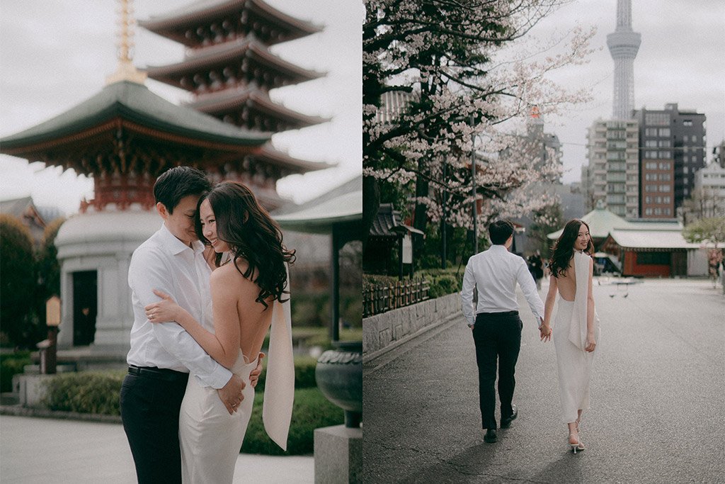 A romantic couple in formal attire, the man in a white shirt and the woman in a white dress, enjoying a moment near a traditional Asian pagoda and Sakura trees, in an urban park setting.