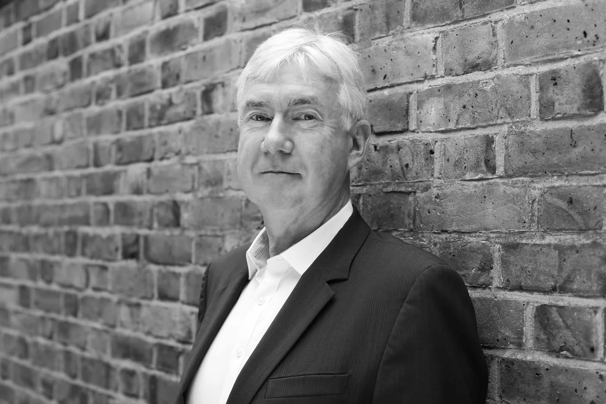 Gerry Canavan, Black Mountain Partners, Project Director, headshot black and white