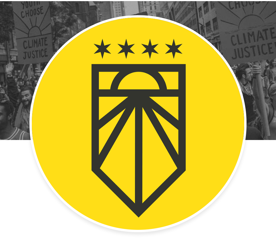 A yellow circular icon featuring a black geometric design resembling a stylized torch or plant, with four stars above it. The background of the icon overlays a black-and-white photo of a crowd holding signs that say 'Youth Choose Climate Justice' at a protest.