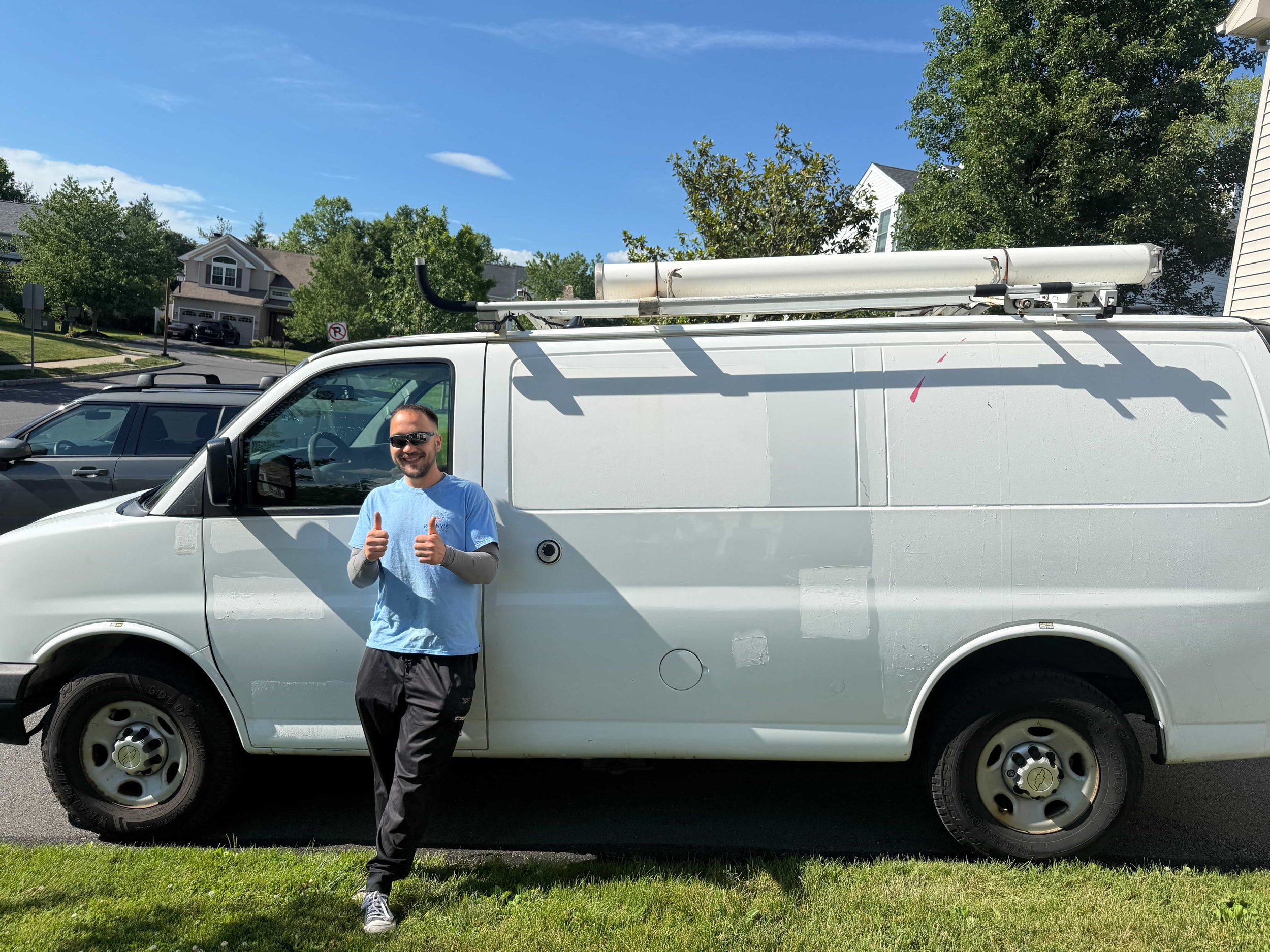 Technician in front of van