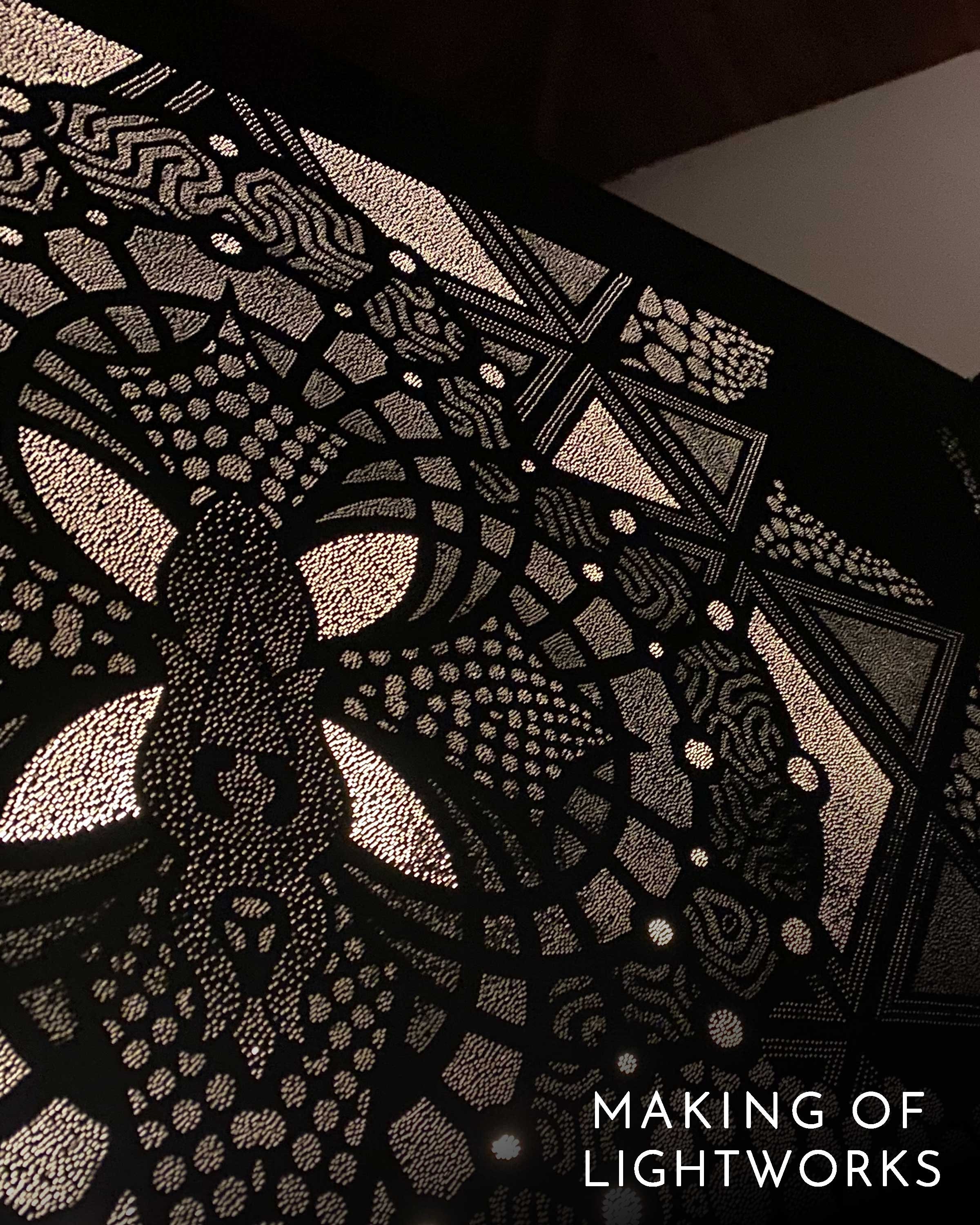 Behind the scenes of Photonic Pointillism Lightworks by Patrick Hüttlinger showing the hand-drilled creation process.