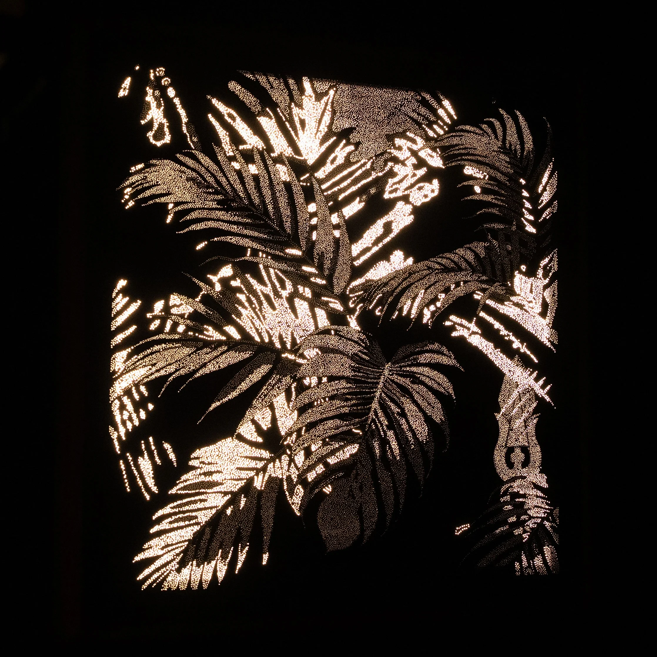 Left-side view of Palma Alba revealing the depth, hand-drilled perforations and sculptural construction of the Photonic Pointillism Lightwork.