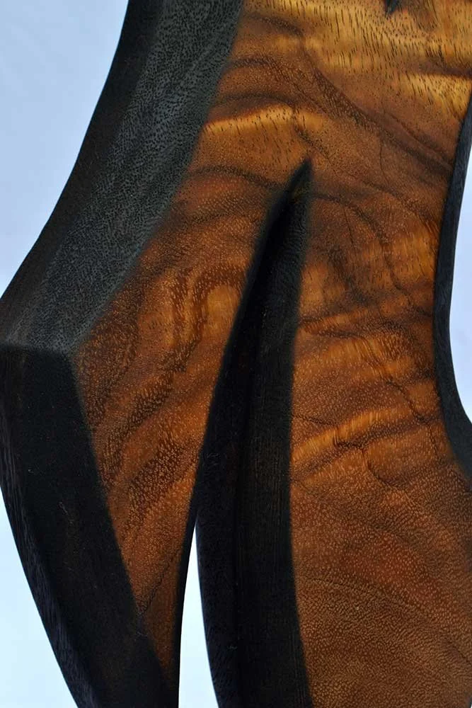 Side profile of Free Flow highlighting its sculptural curves, negative space and handcrafted organic form.