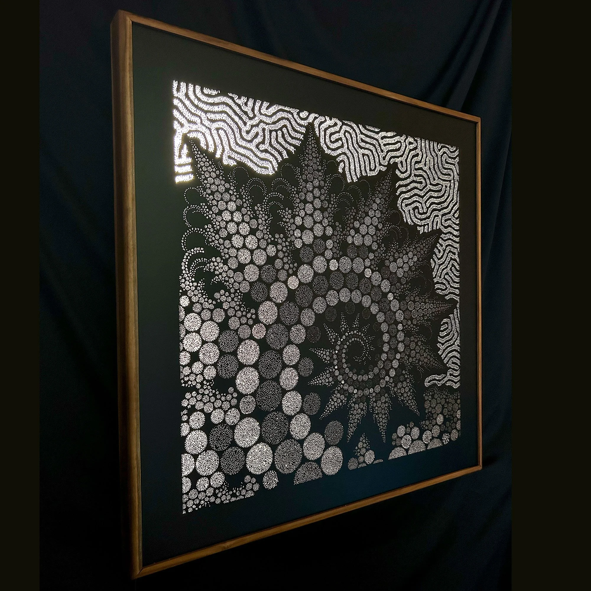 Left-side view of Pura Biophilia revealing the depth, hand-drilled perforations and sculptural construction of the Photonic Pointillism Lightwork.