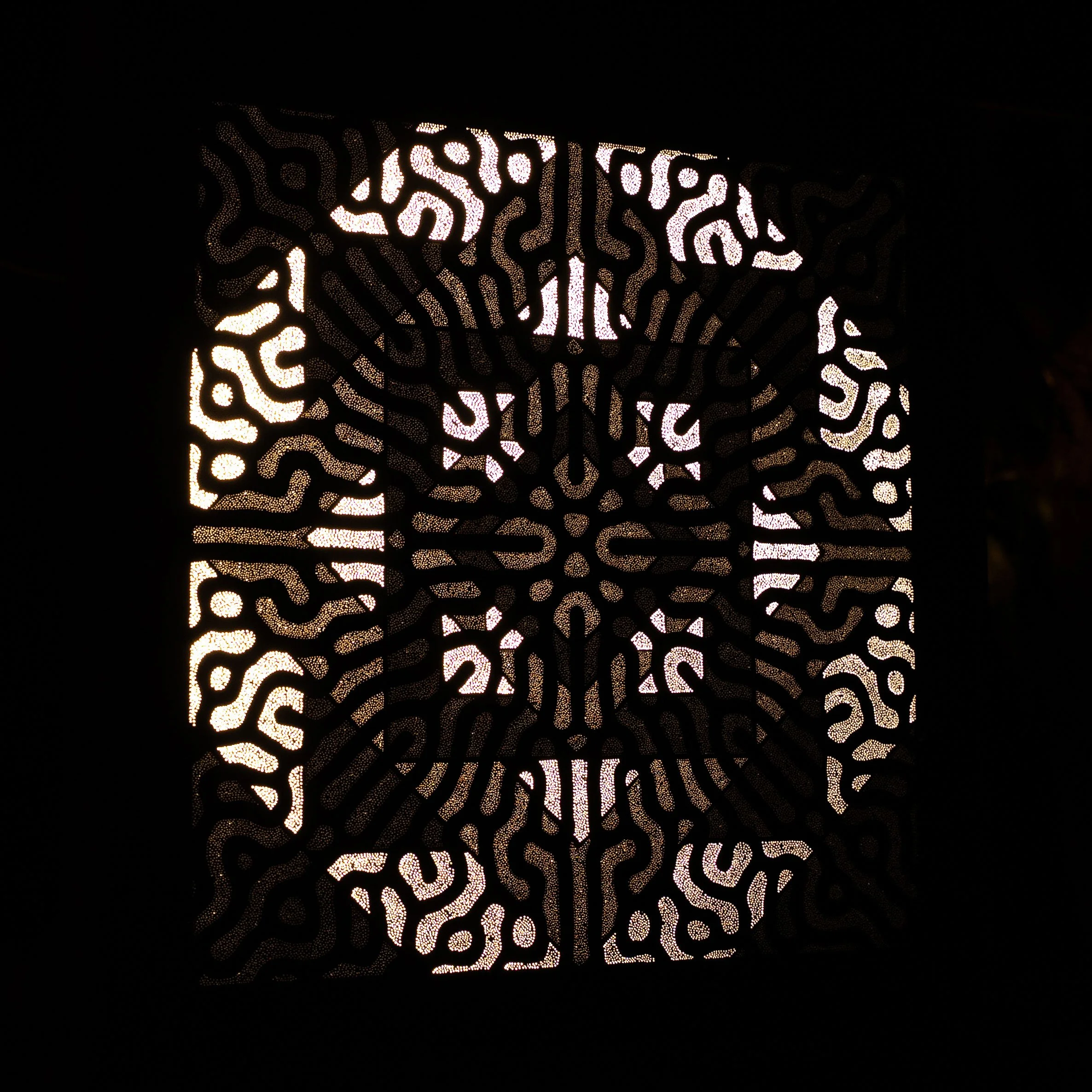Left-side view of Shakti's Shiva revealing the depth, hand-drilled perforations and sculptural construction of the Photonic Pointillism Lightwork.