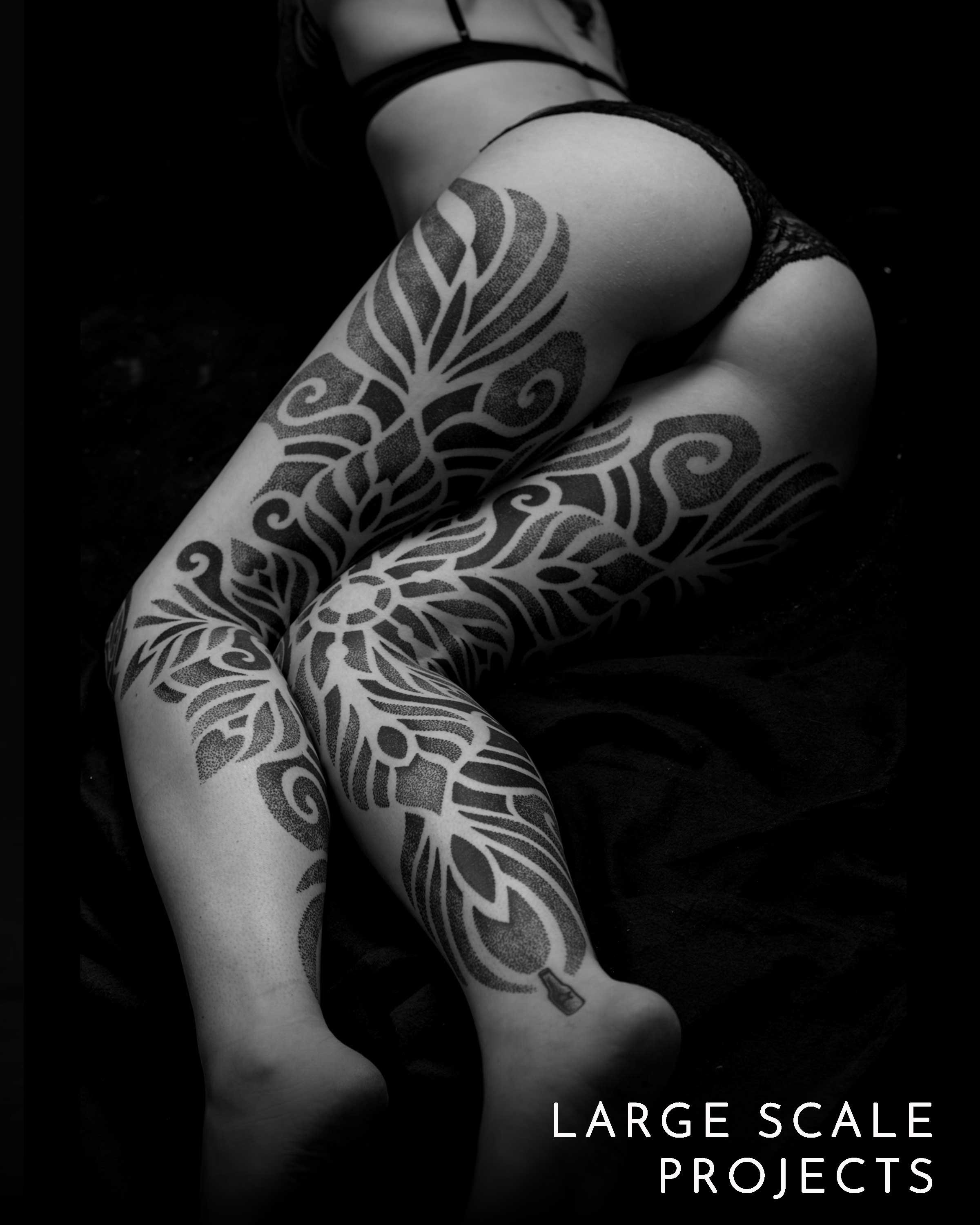 Large-scale geometric tattoo projects by Patrick Hüttlinger designed to flow naturally with the body's anatomy.