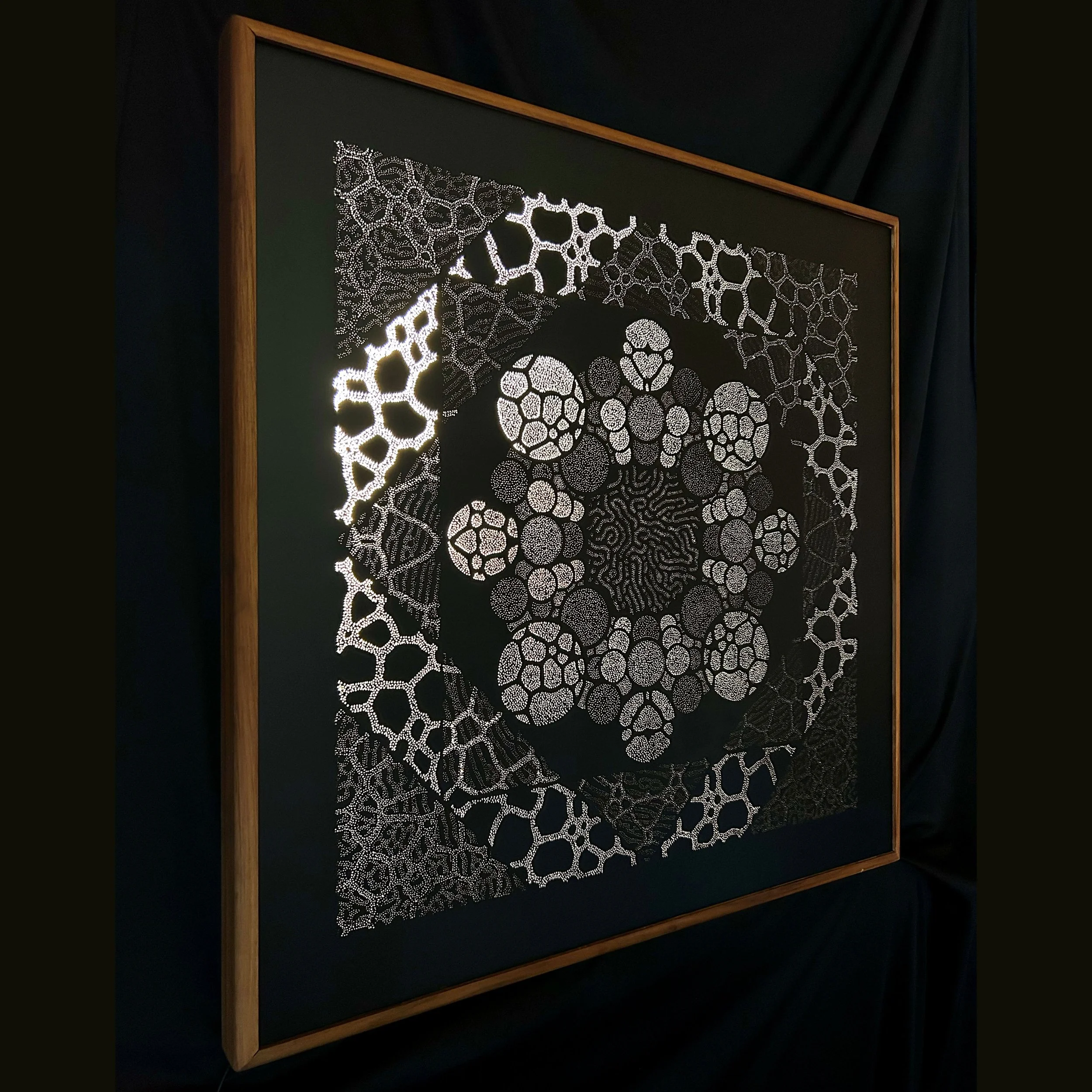 eft-side view of Forma Naturalis revealing the depth, hand-drilled perforations and sculptural construction of the Photonic Pointillism Lightwork.