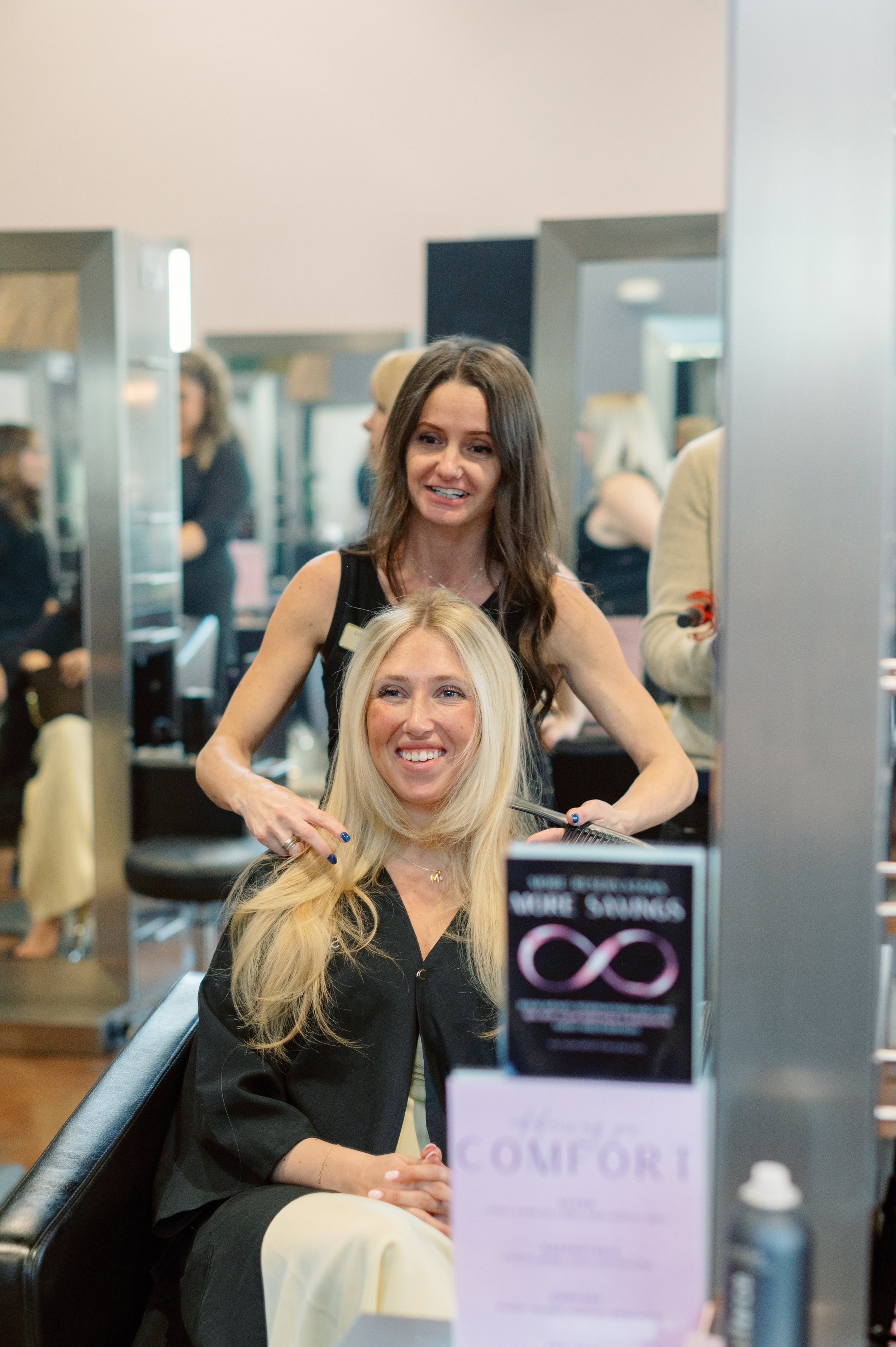 Amberlee — precision cutting, dimensional color, and textured hair specialist at Salon Norrell AVEDA in Carrollwood Tampa doing a bouncy blowout