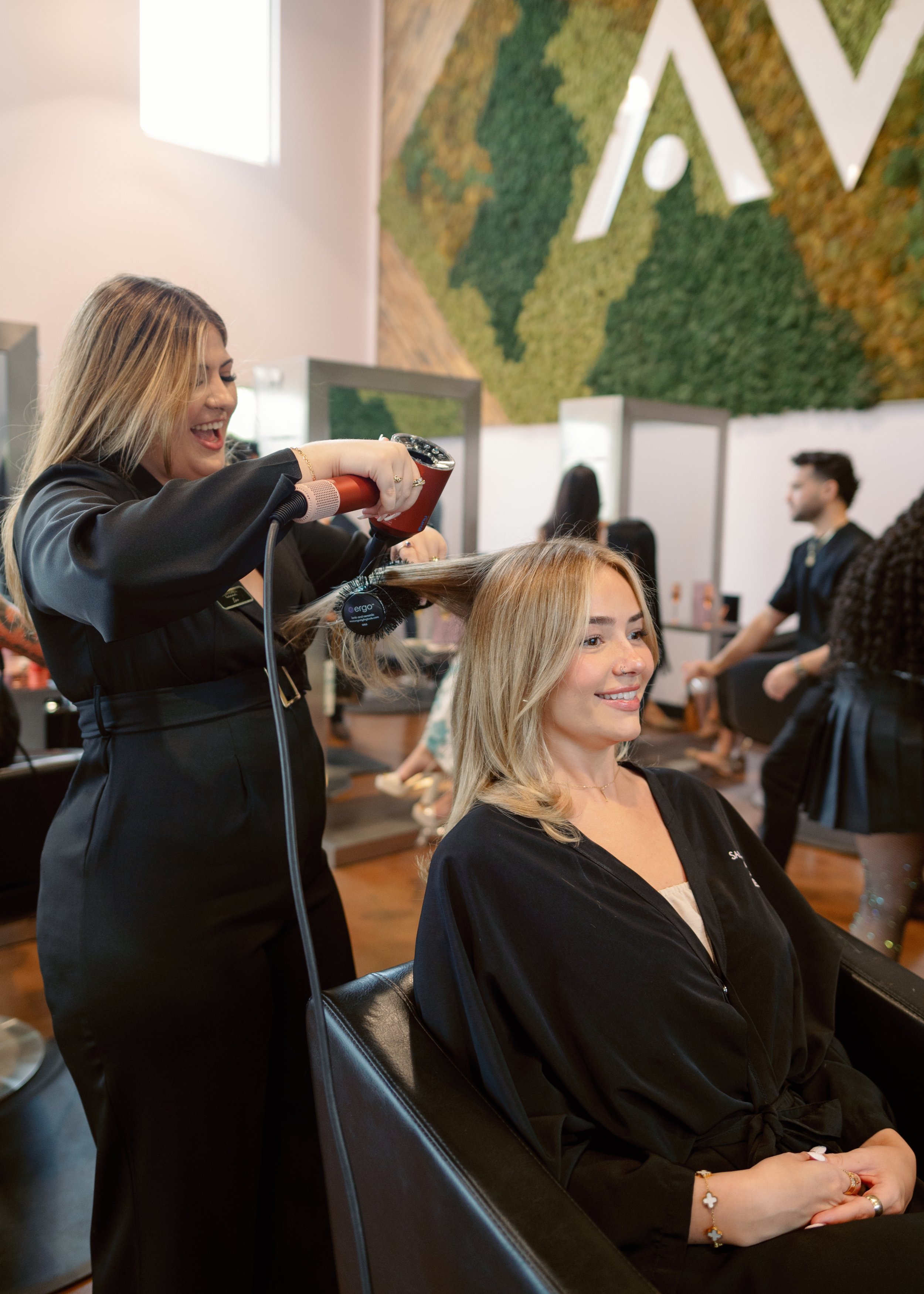 Lina — dimensional blonding, full blonding, and lived-in blonde specialist at Salon Norrell AVEDA in Hyde Park Tampa doing full blonding highlights