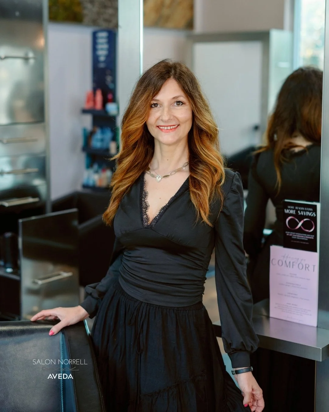 Nina — dimensional brunette, balayage, and lived-in color specialist at Salon Norrell AVEDA in Carrollwood Tampa