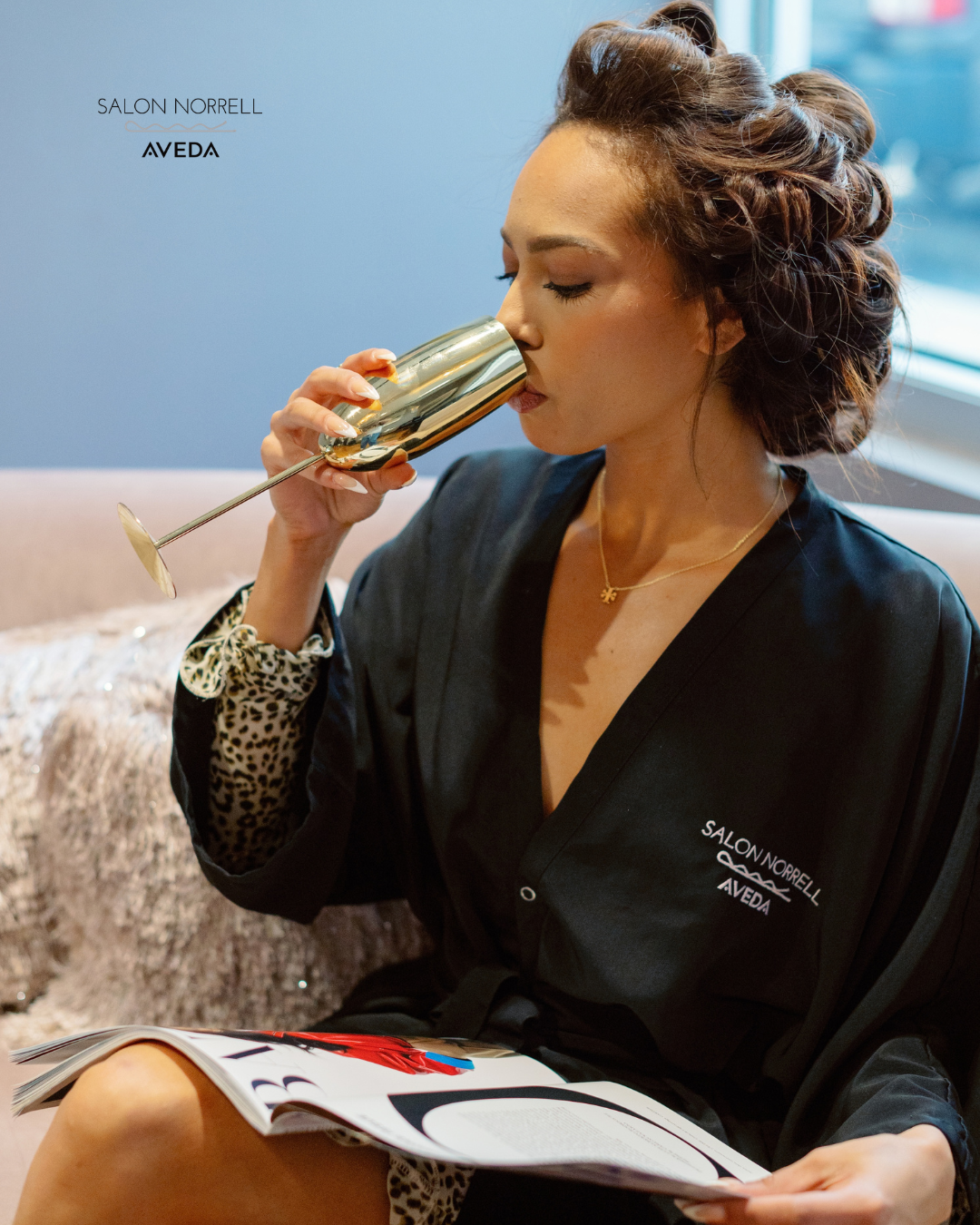 Luxury salon experience with complimentary beverage at Salon Norrell Aveda Tampa.