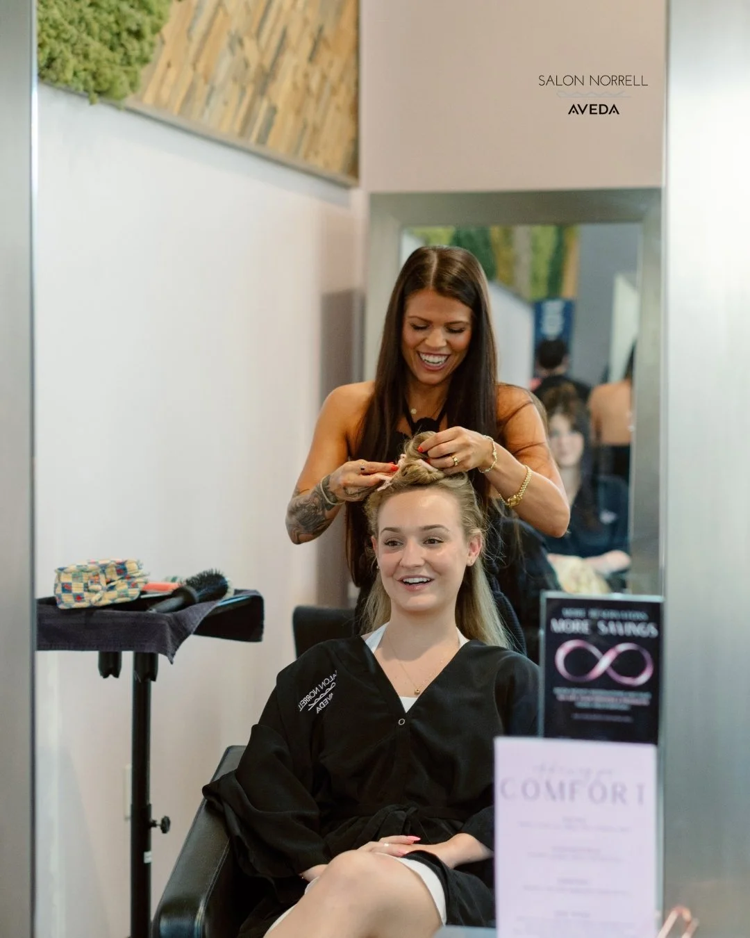 Jessica — dimensional balayage, blonding, Bellami, VoMor, and Butterfly extension specialist and long hair stylist at Salon Norrell AVEDA in Carrollwood Tampa doing a bouncy blowout and extension service