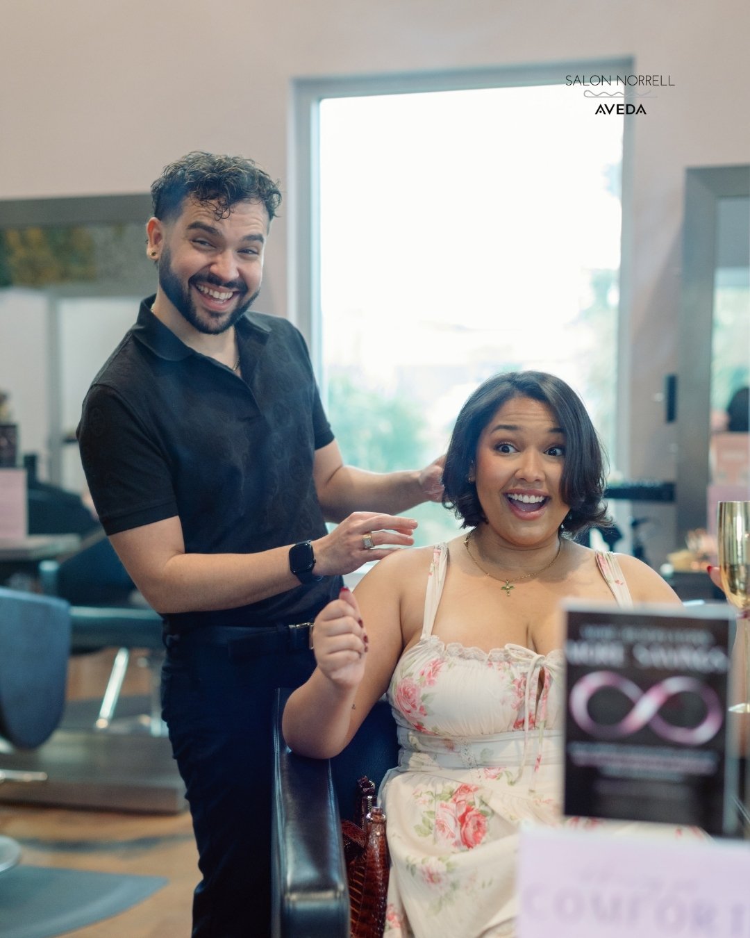 Cesar — curly hair, vibrant color, and blonding specialist at Salon Norrell AVEDA in Carrollwood Tampa performing a curly cut and bouncy blowout on model
