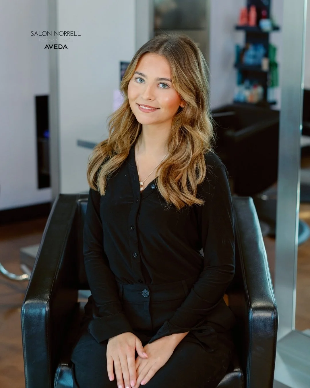 Adriana — lived-in blonding, hair extension, and bouncy blowout specialist at Salon Norrell AVEDA in Hyde Park Tampa