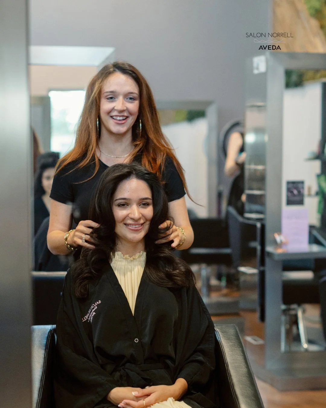 Katie — copper color, dimensional blonding, and balayage specialist at Salon Norrell AVEDA in Carrollwood Tampa doing a bouncy blowout