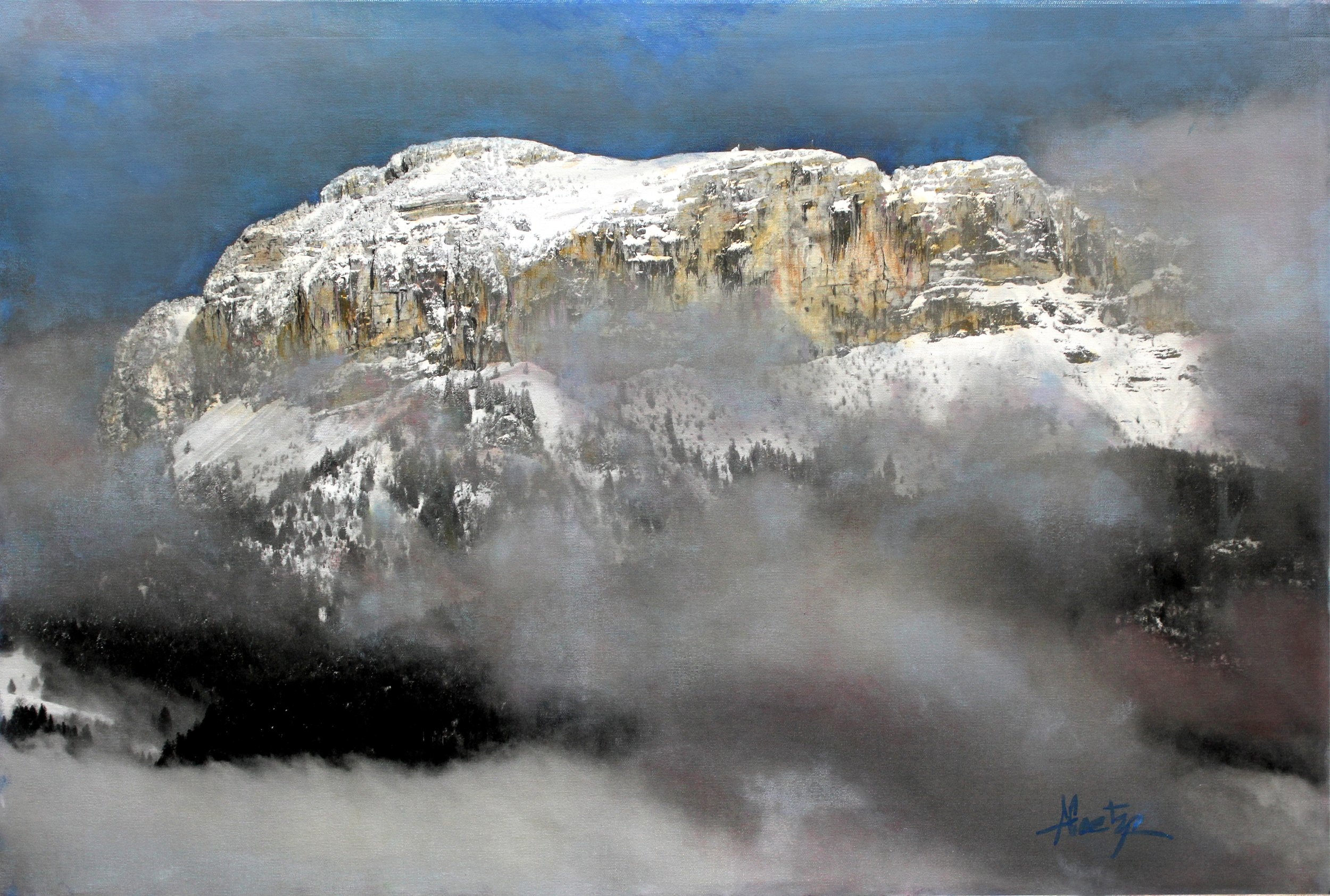 A snow-covered mountain with rocky cliffs, partly shrouded in mist, under a dark sky.
