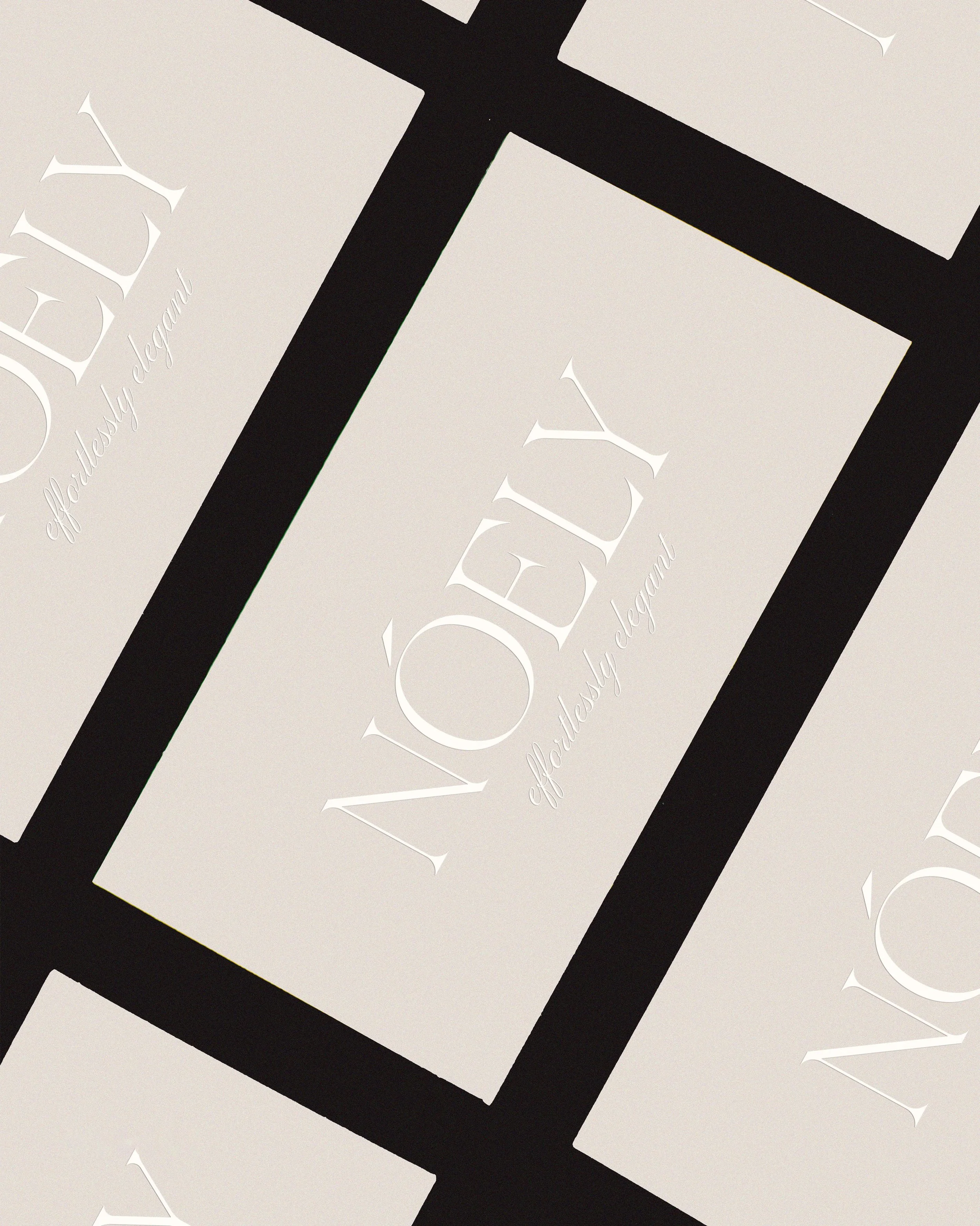 Close-up of a black-and-white logo with the word "Edel" in white stylized font on a white background, partially overlaid with a black border.