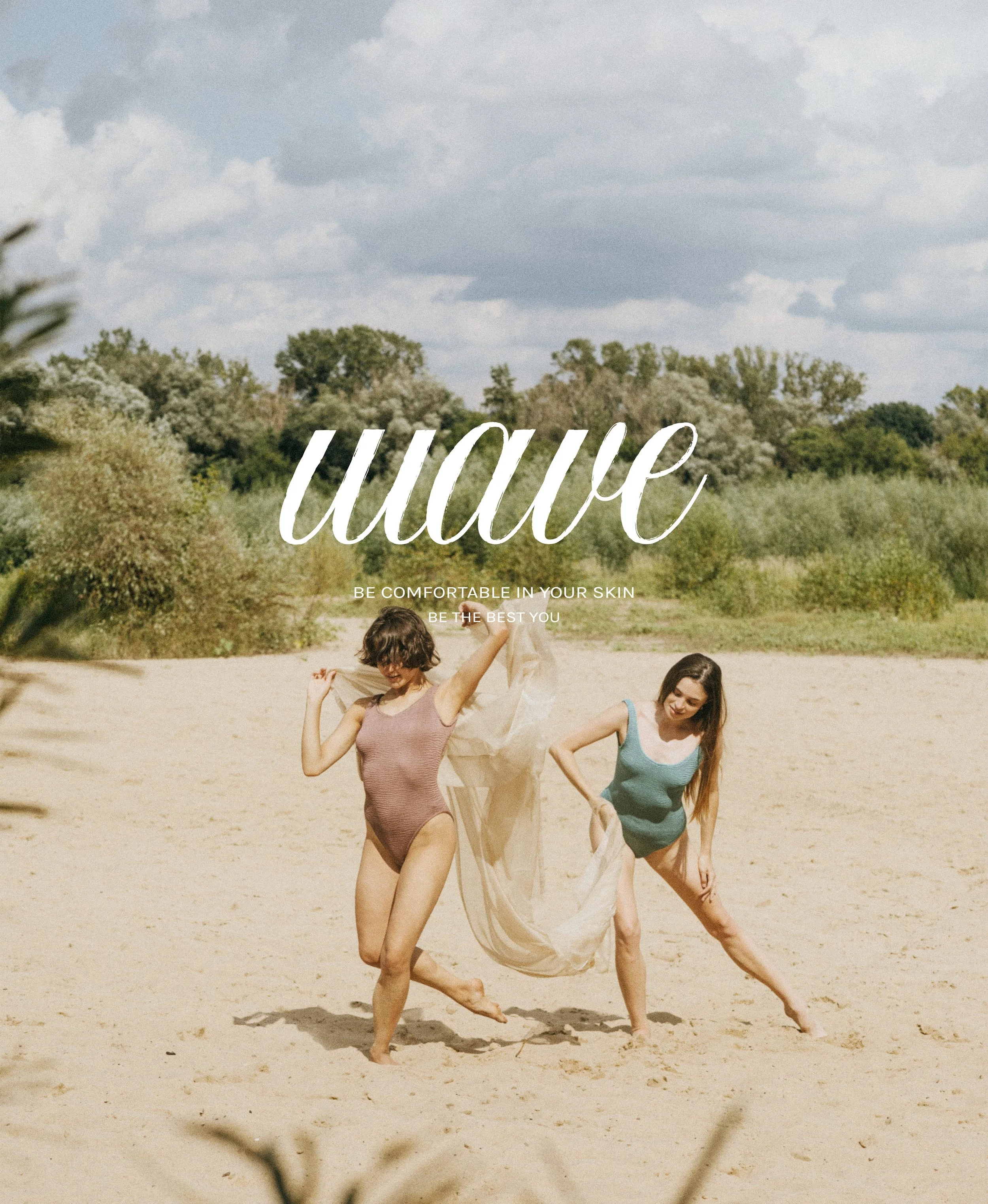 Two women dancing on a sandy outdoor area with trees and cloudy sky in the background.