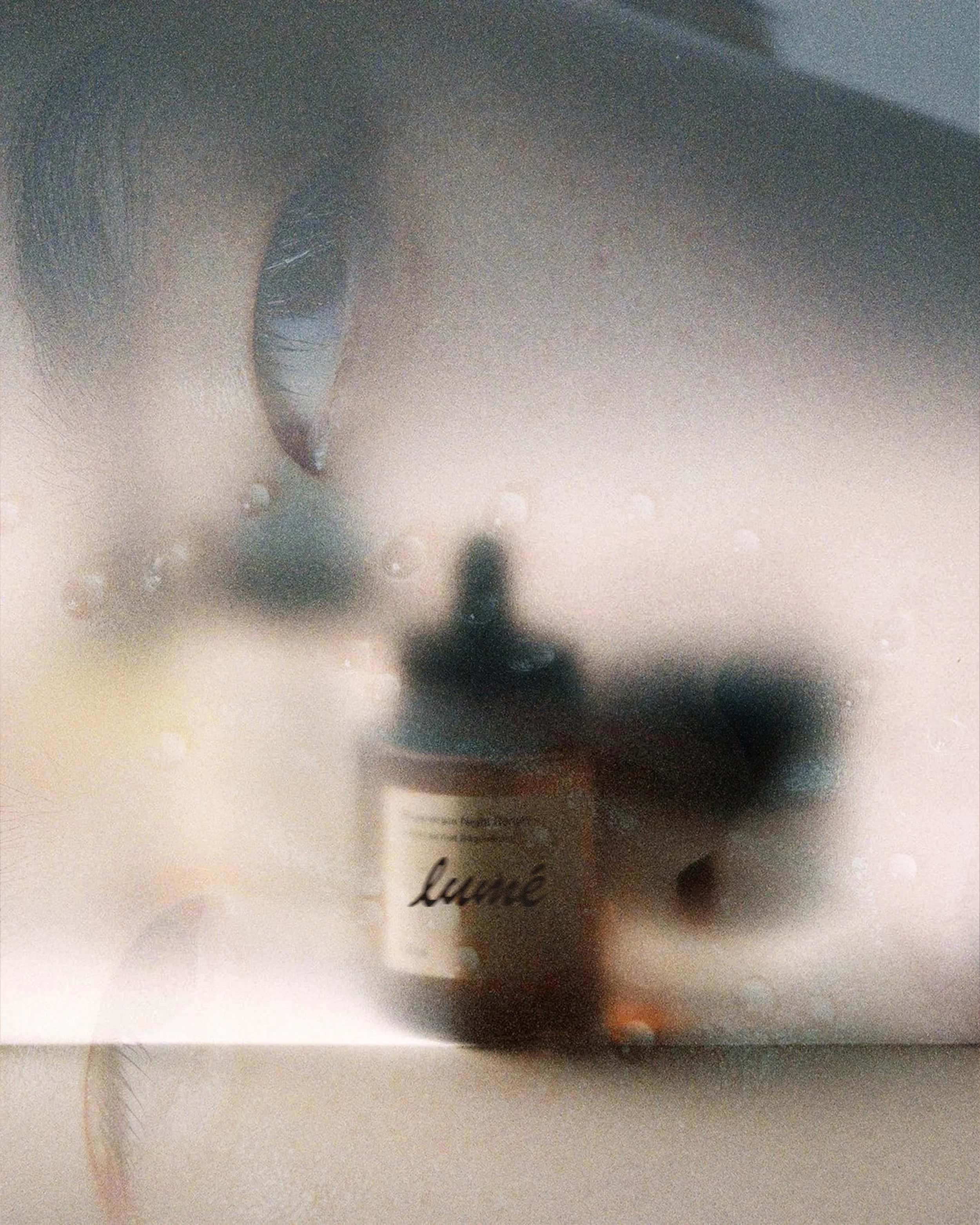 Close-up of a candle with a label that has the word 'love' written in cursive.