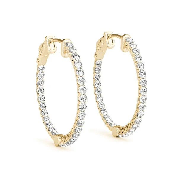 Gold hoop earrings encrusted with diamonds.