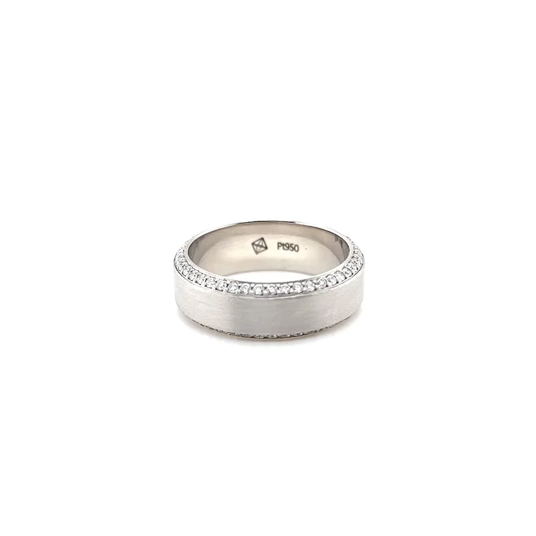 Men's wedding band, platinum ring with small diamonds around the band, marked P950 inside.