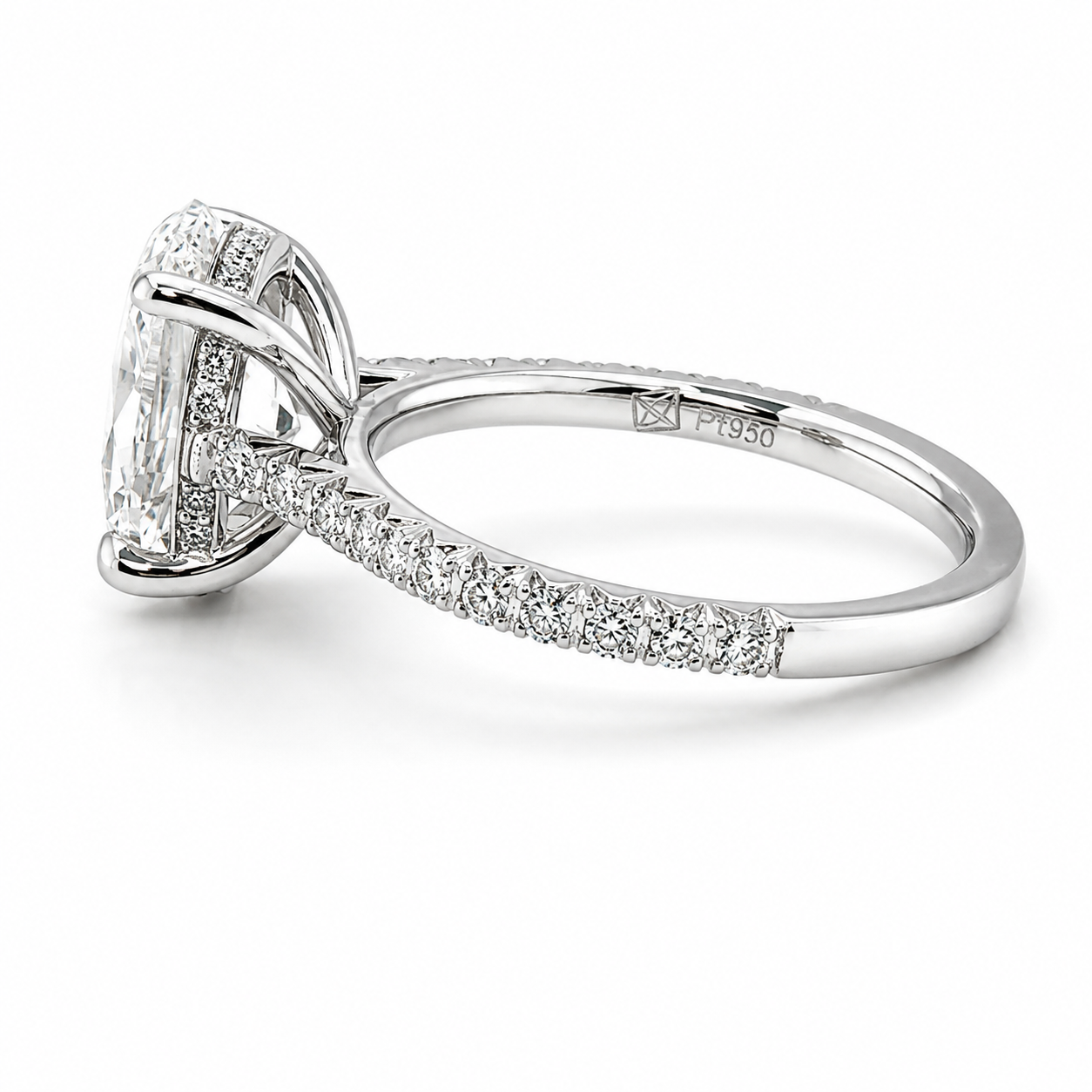 Platinum engagement ring with a large oval diamond and smaller diamonds on the band