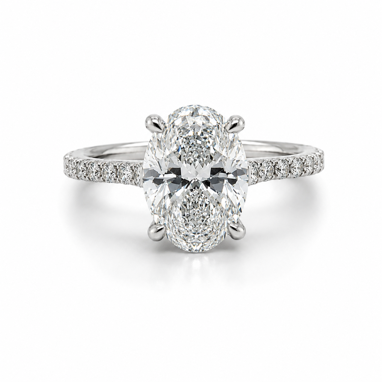 A diamond engagement ring with an oval-shaped center stone and smaller stones along the band.