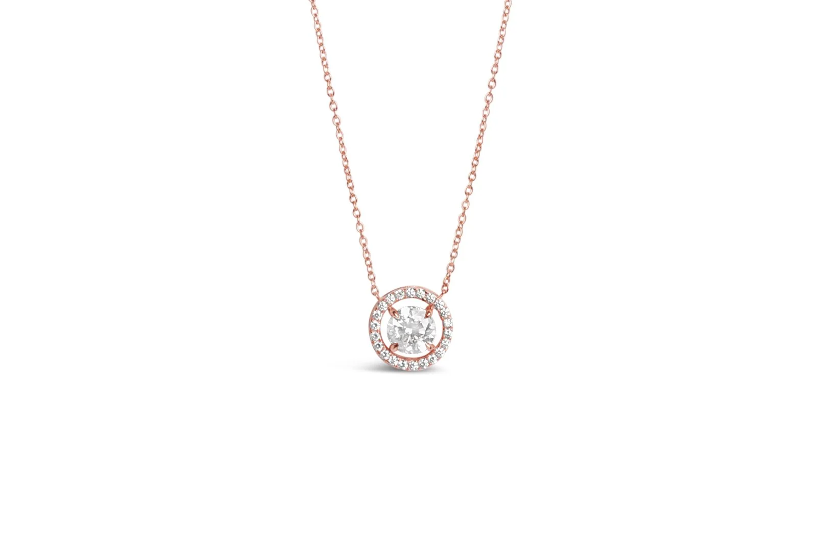 Rose gold necklace with a round diamond pendant surrounded by smaller diamonds