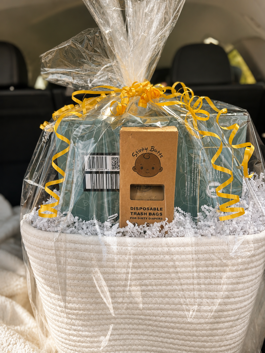 Stinky Butts baby shower gift, featuring a box of disposal diaper bags and specialty diapers