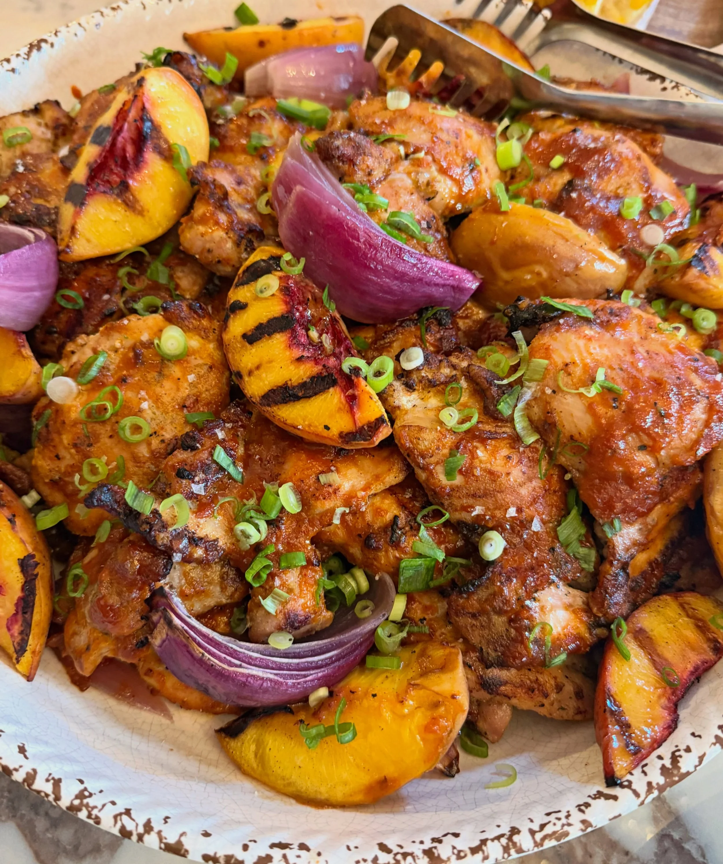 A taste of SUMMER! 
Grilled chicken and peaches with my scratch made peach gochujang bbq sauce 😍☀️🍑