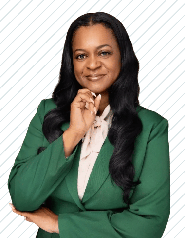 Professional woman with long black hair wearing a green blazer and white blouse, Kimberly Johnson of Bay Wellness Group.